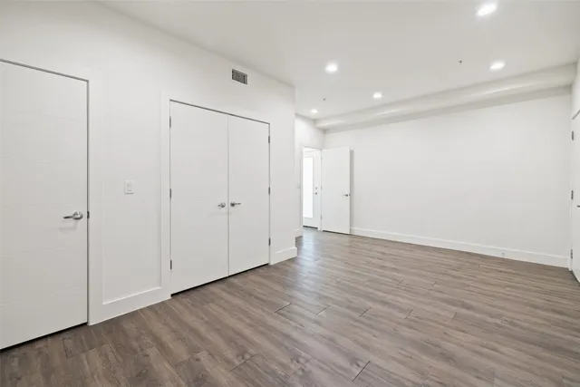 a kitchen with stainless steel appliances granite countertop a stove microwave and oven