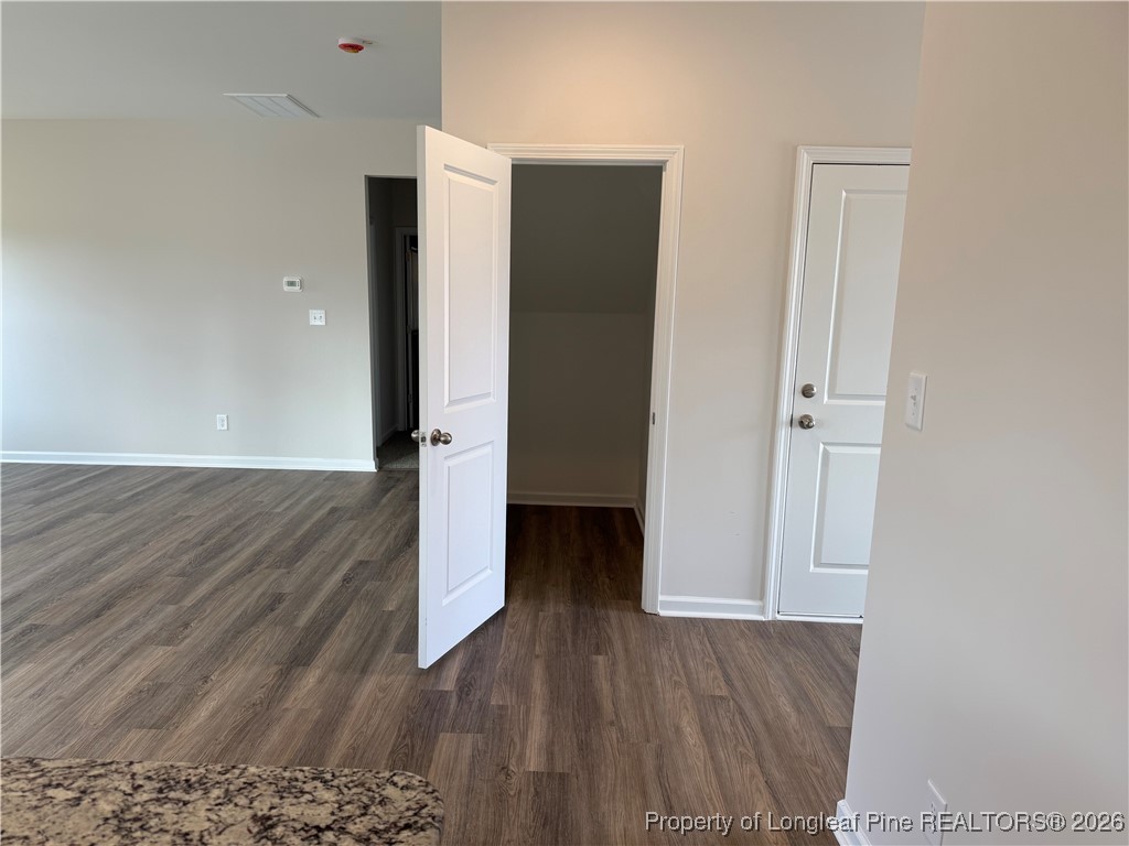 471 Ashley Hts Drive Aberdeen, NC 28315 - Photo 12 of 38 an empty room with wooden floor and entrance