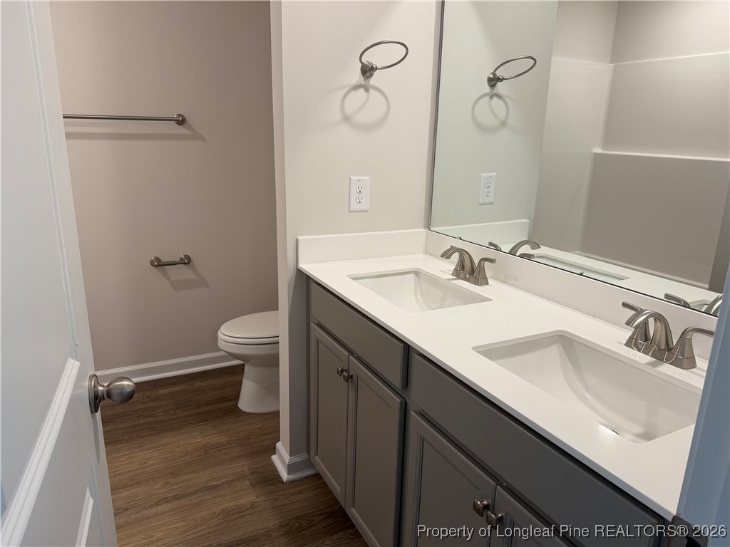 471 Ashley Hts Drive Aberdeen, NC 28315 - Photo 27 of 38 a bathroom with a sink and a mirror