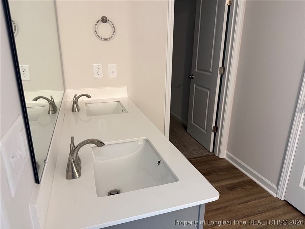 471 Ashley Hts Drive Aberdeen, NC 28315 - Photo 34 of 38 a bathroom with a sink a toilet and mirror