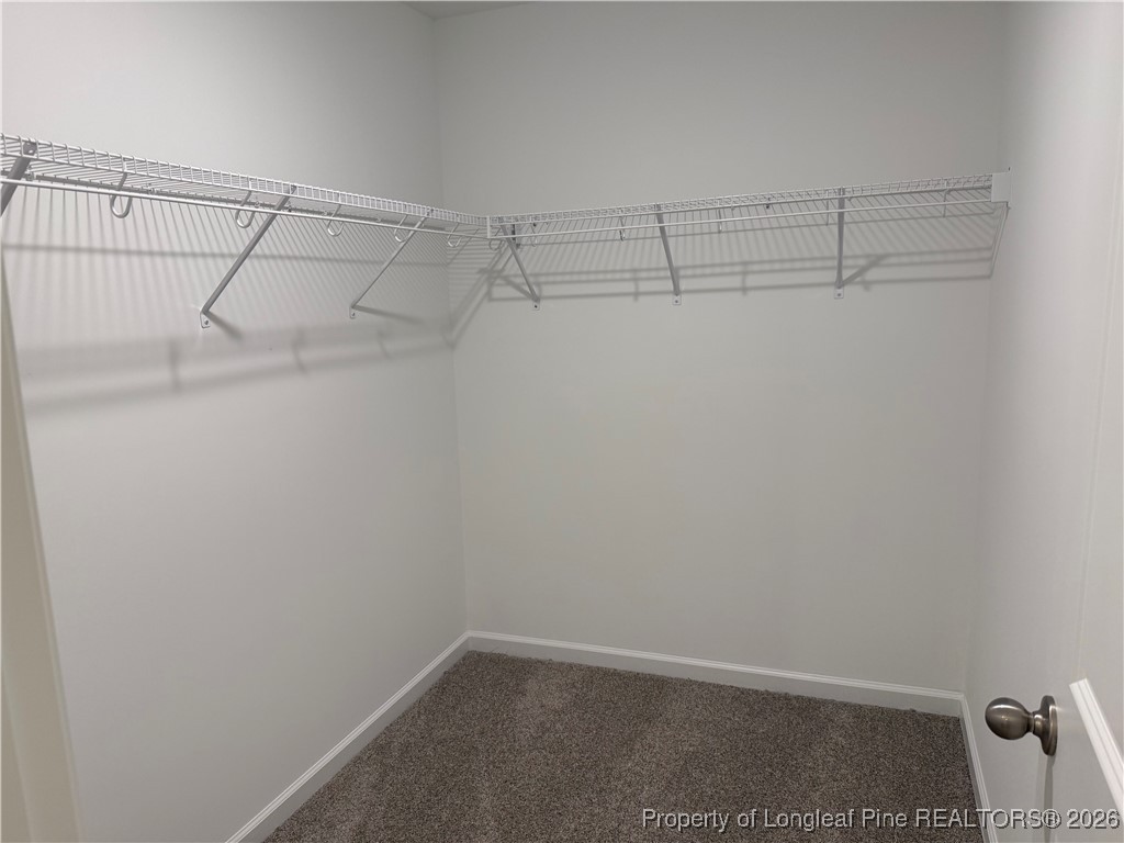 471 Ashley Hts Drive Aberdeen, NC 28315 - Photo 36 of 38 a view of a room with racks on the wall