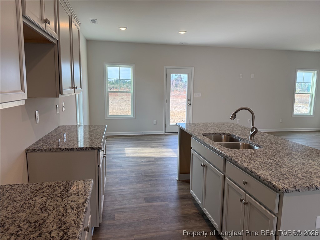 471 Ashley Hts Drive Aberdeen, NC 28315 - Photo 9 of 38 a kitchen with stainless steel appliances granite countertop a sink stove and cabinets