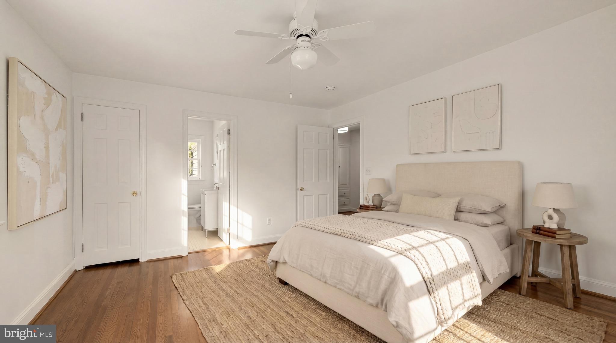 3640 Brandywine Street Northwest Washington, DC 20008 - Photo 23 of 39 a bedroom with a bed and a chandelier