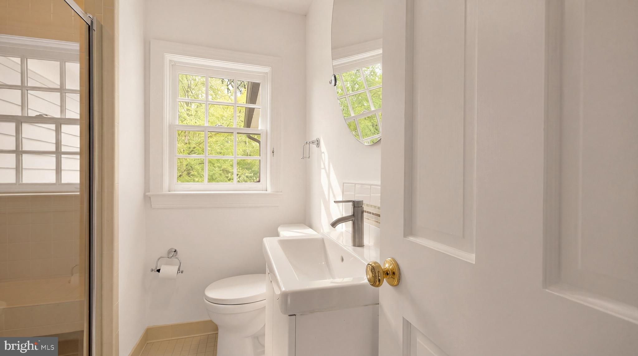 3640 Brandywine Street Northwest Washington, DC 20008 - Photo 24 of 39 a white toilet sitting next to a bathroom sink