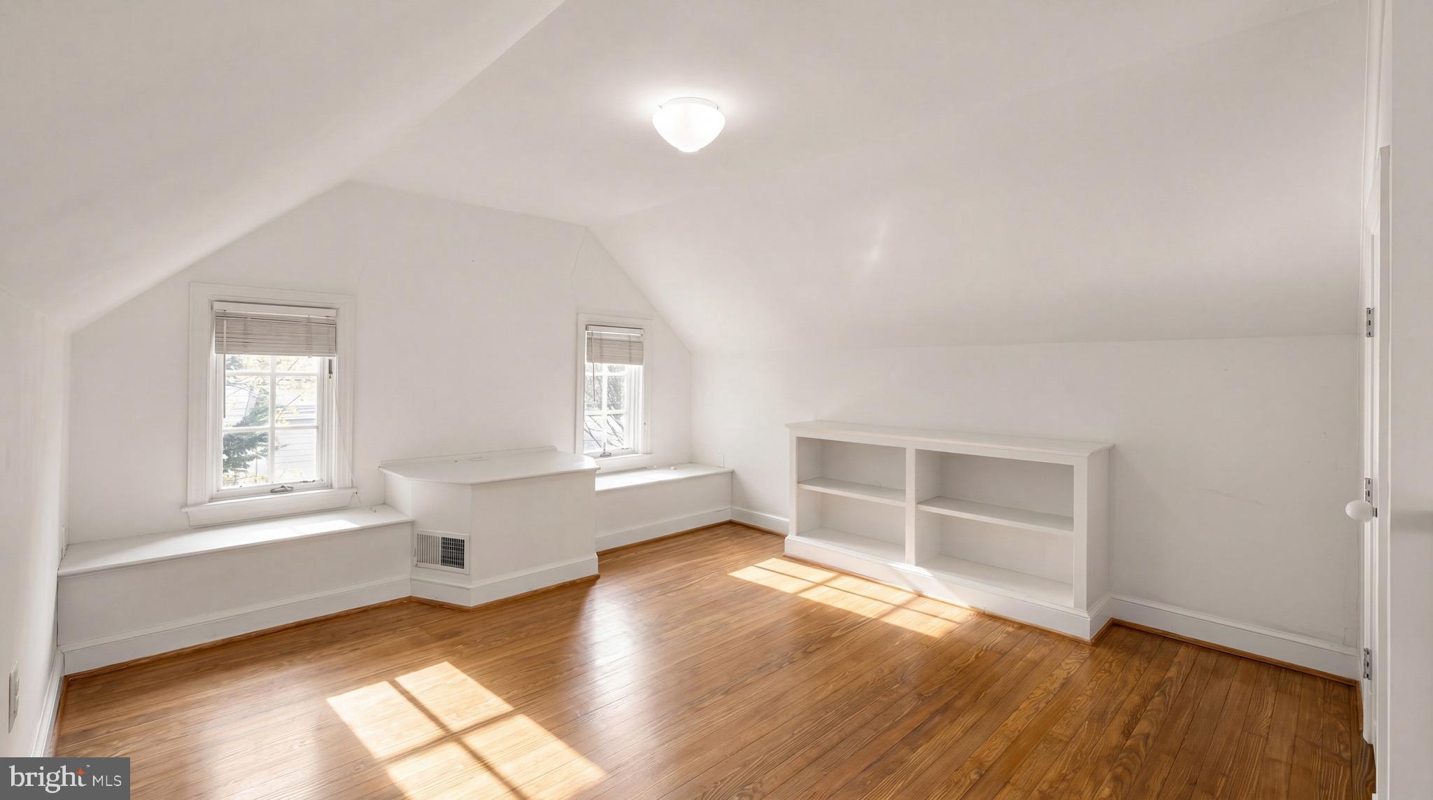 3640 Brandywine Street Northwest Washington, DC 20008 - Photo 29 of 39 an empty room with wooden floor and windows