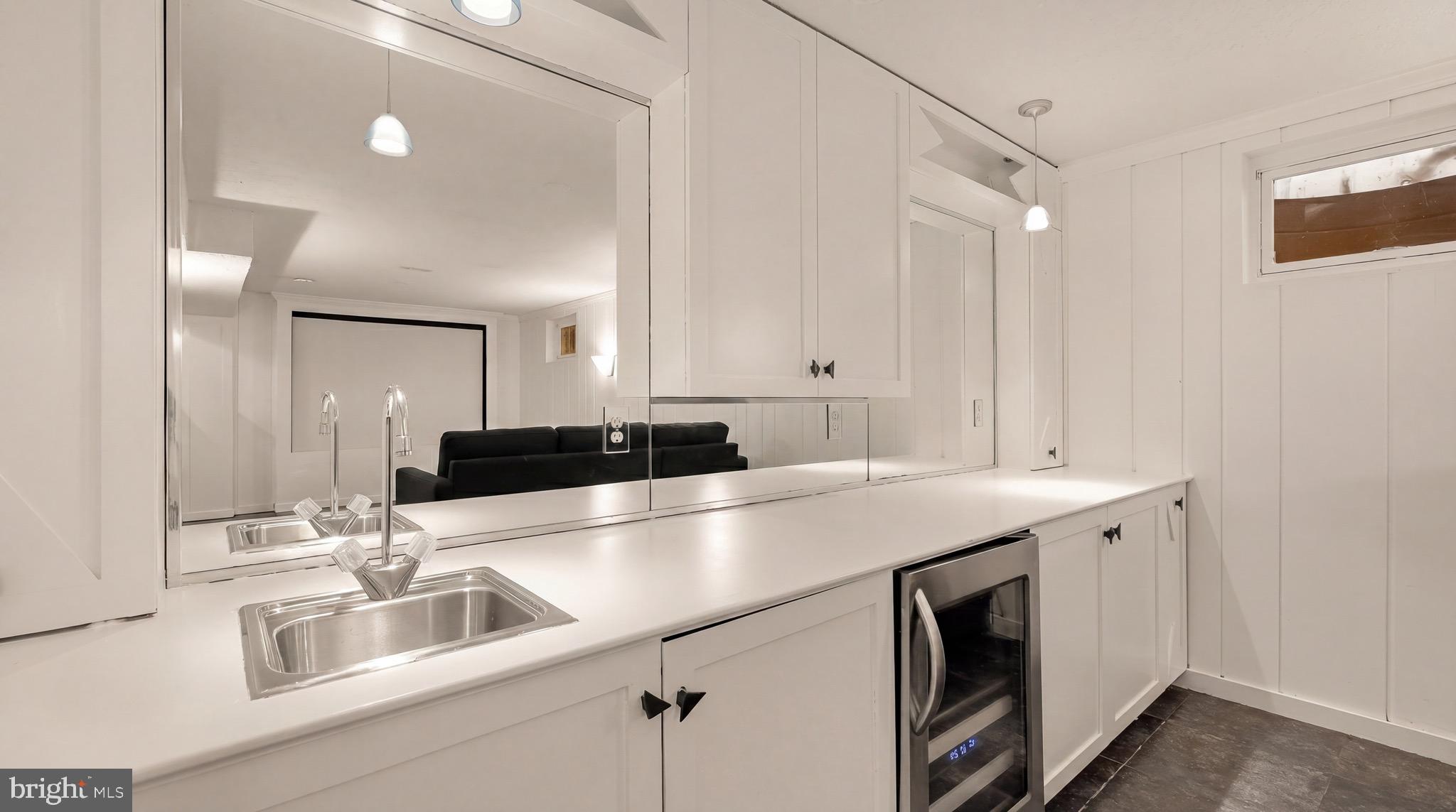 3640 Brandywine Street Northwest Washington, DC 20008 - Photo 31 of 39 a kitchen with a sink and a refrigerator