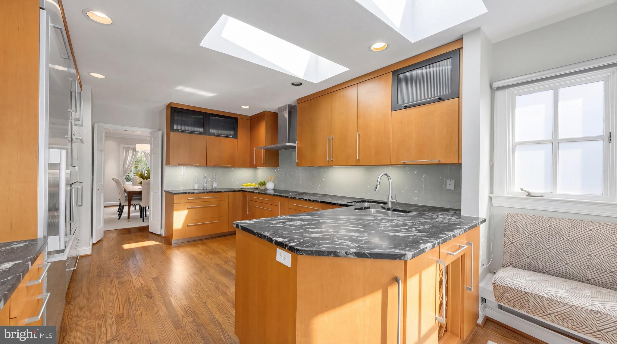 3640 Brandywine Street Northwest Washington, DC 20008 - Photo 7 of 39 a kitchen with a sink a counter top space and cabinets