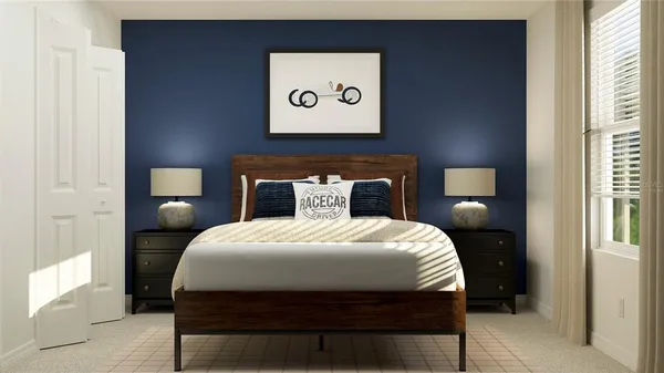 a bedroom with a bed and a lamp on dresser