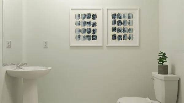 a bathroom with a sink mirror and toilet