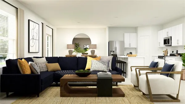 a living room with furniture fireplace and a large window