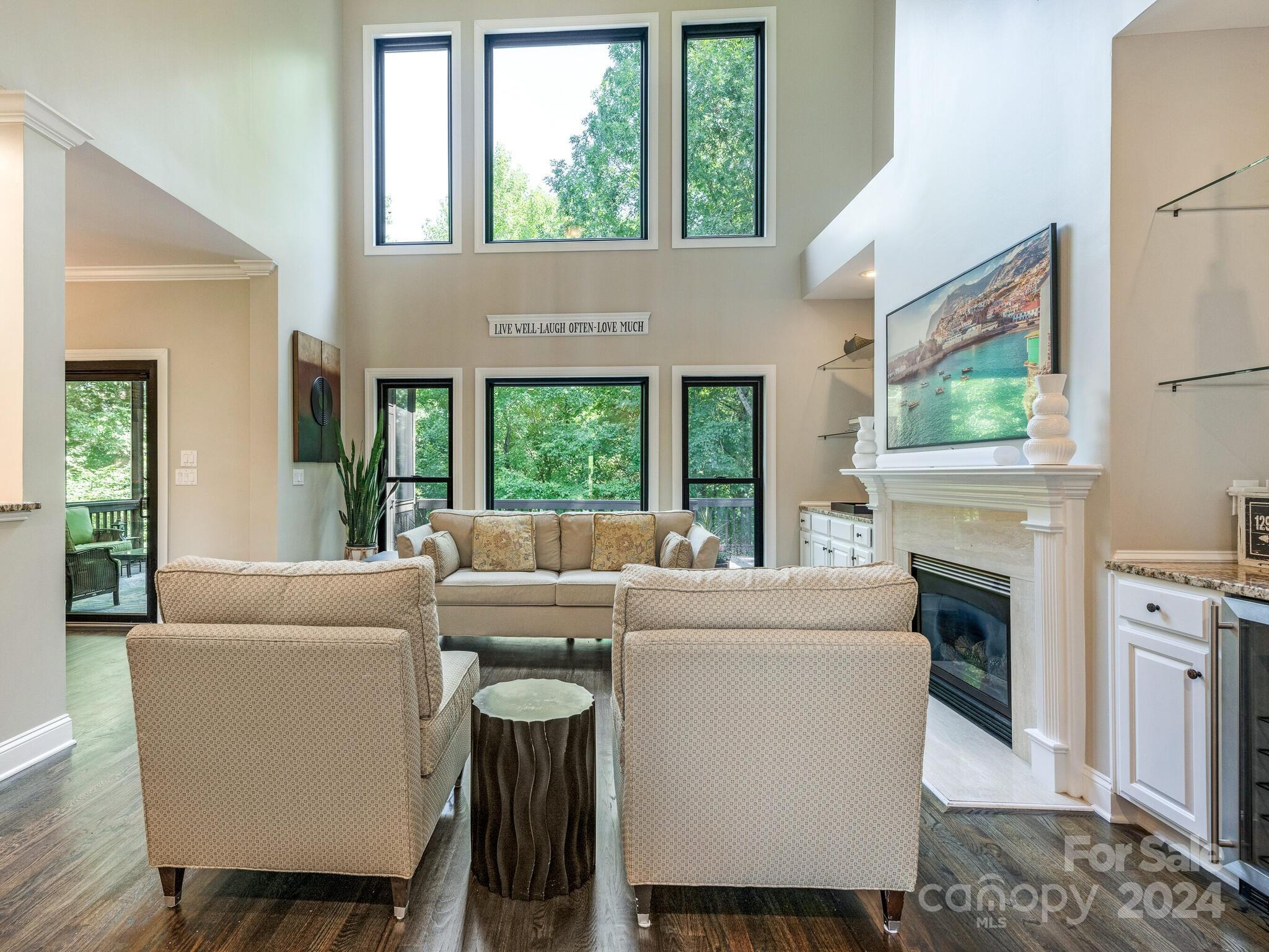 3234 Planters Ridge Road Charlotte, NC 28270 - Photo 12 of 33 a living room with furniture a fireplace and a large window