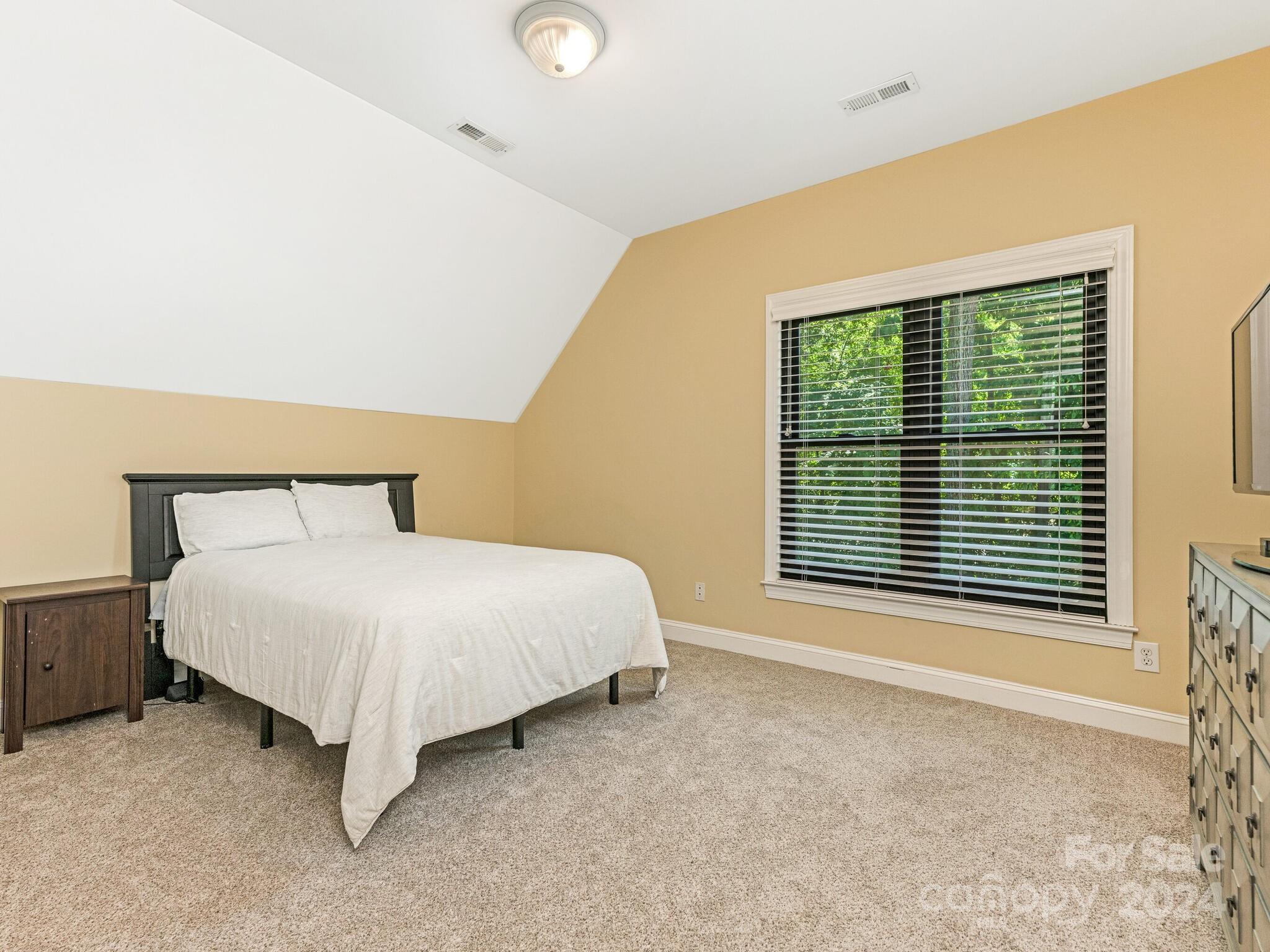 3234 Planters Ridge Road Charlotte, NC 28270 - Photo 20 of 33 a bed room with a bed and a window