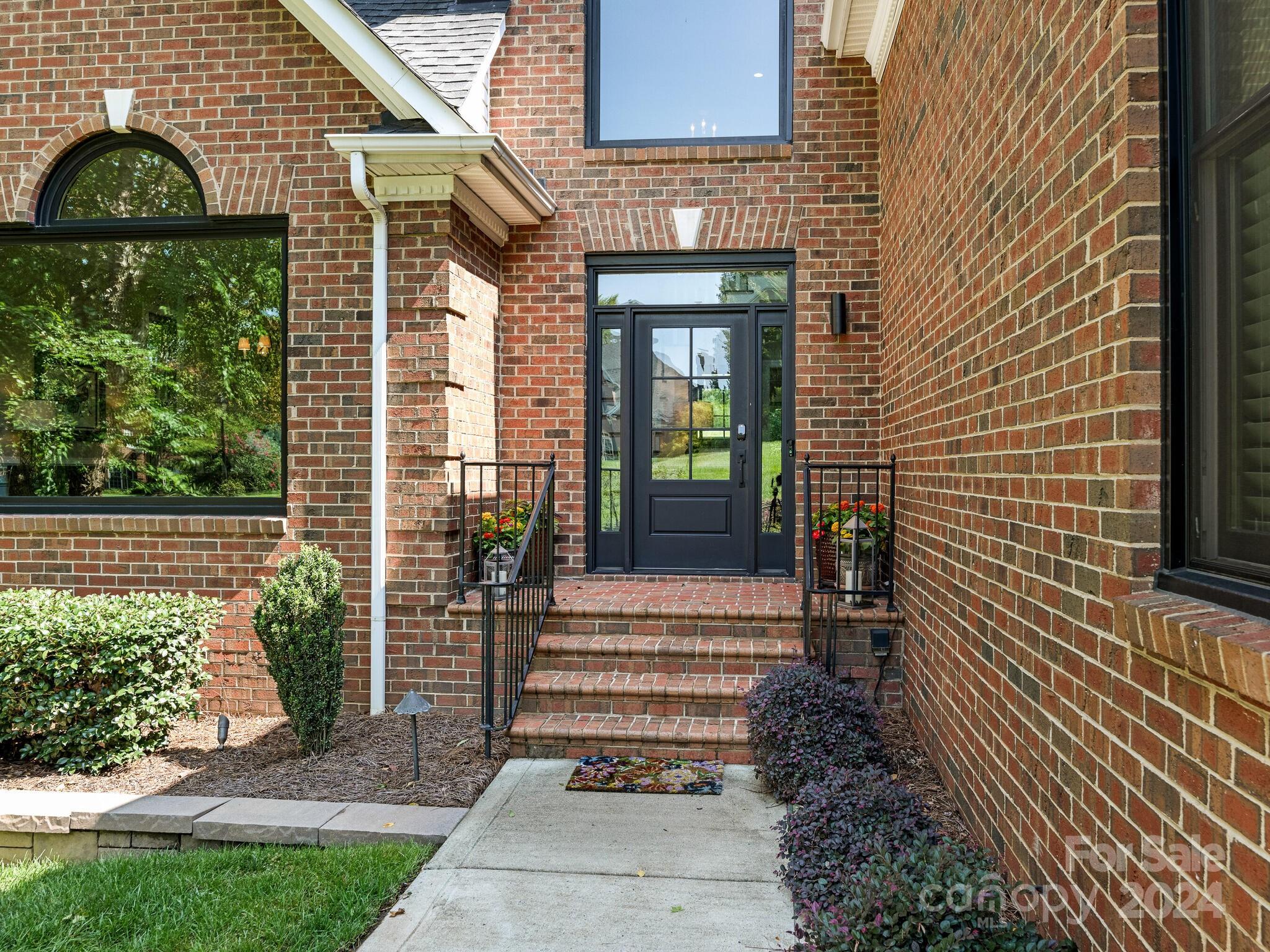 3234 Planters Ridge Road Charlotte, NC 28270 - Photo 2 of 33 a view of a house with a small yard and plants