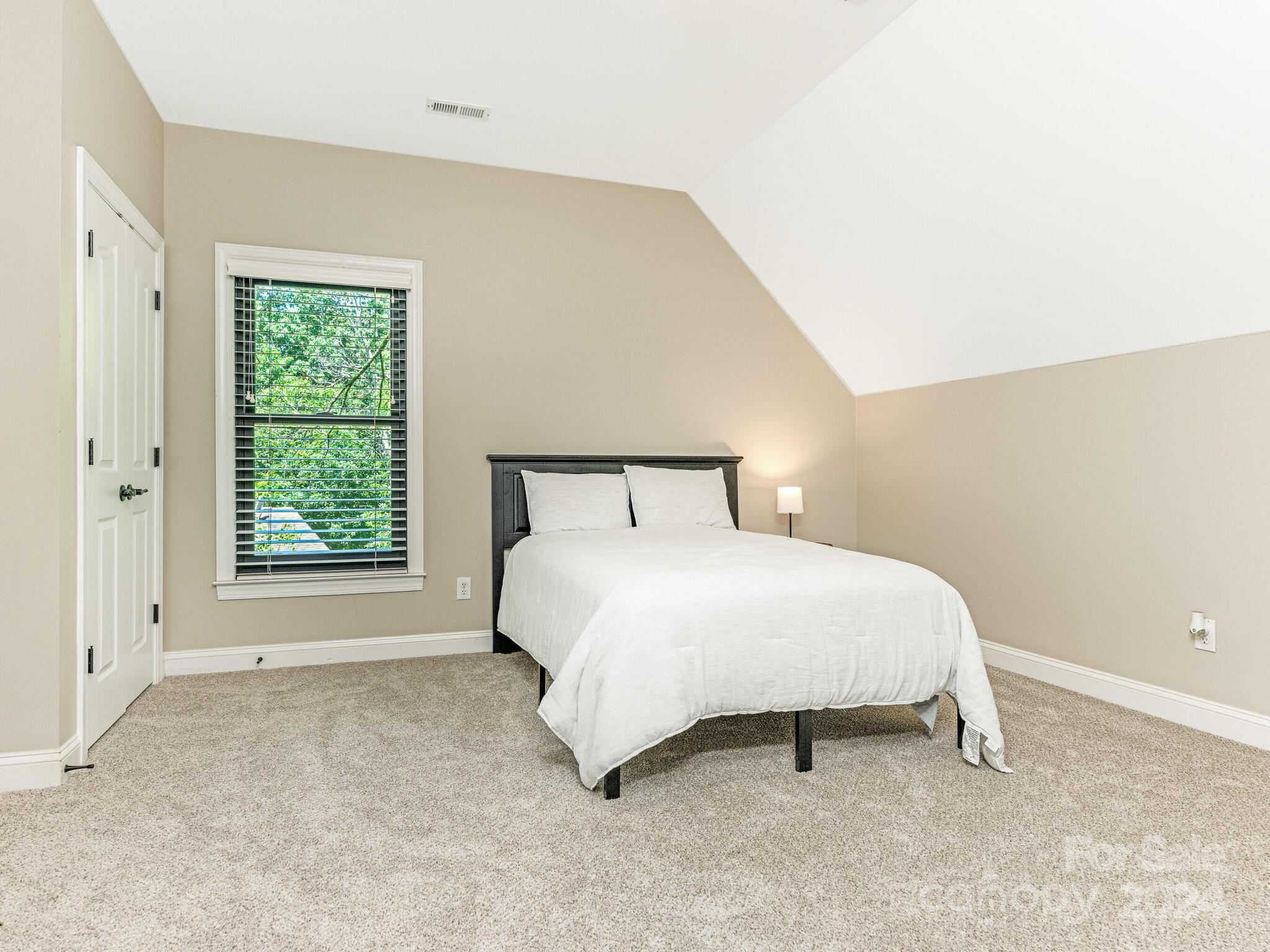 3234 Planters Ridge Road Charlotte, NC 28270 - Photo 22 of 33 a bedroom with a bed and a window