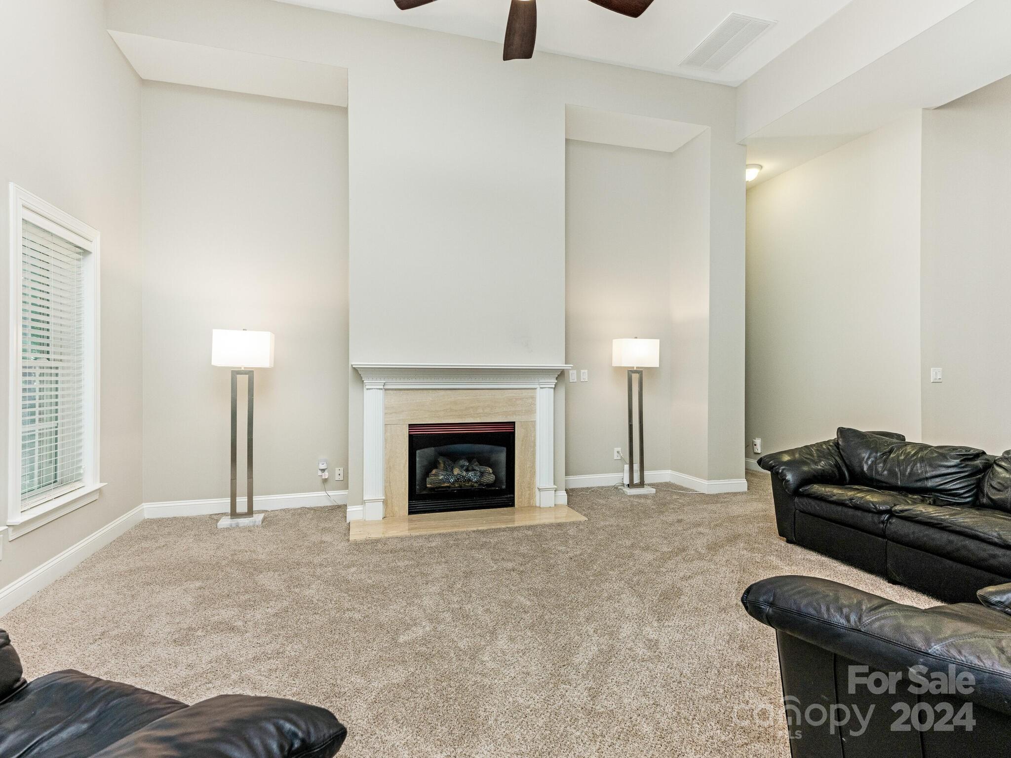 3234 Planters Ridge Road Charlotte, NC 28270 - Photo 26 of 33 a living room with furniture and a fireplace
