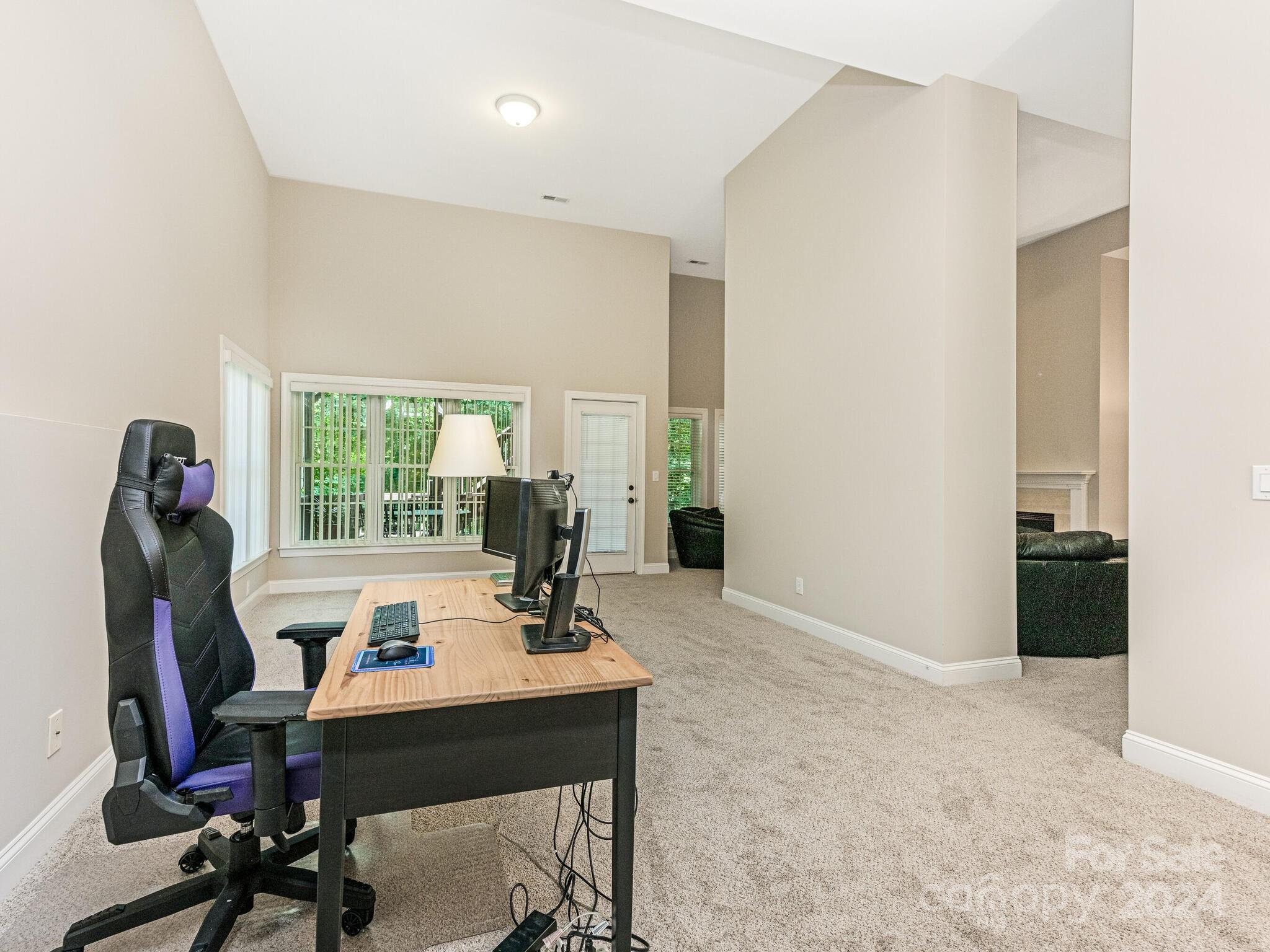 3234 Planters Ridge Road Charlotte, NC 28270 - Photo 27 of 33 a view of a workspace with furniture and a window