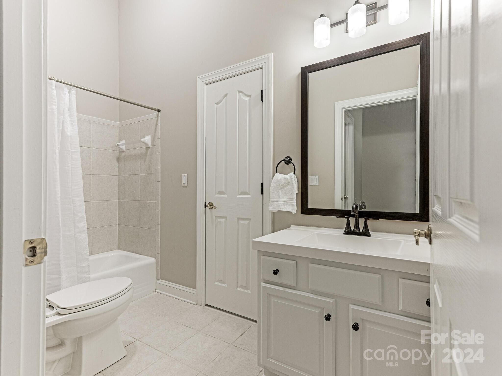 3234 Planters Ridge Road Charlotte, NC 28270 - Photo 30 of 33 a bathroom with a sink a toilet and shower