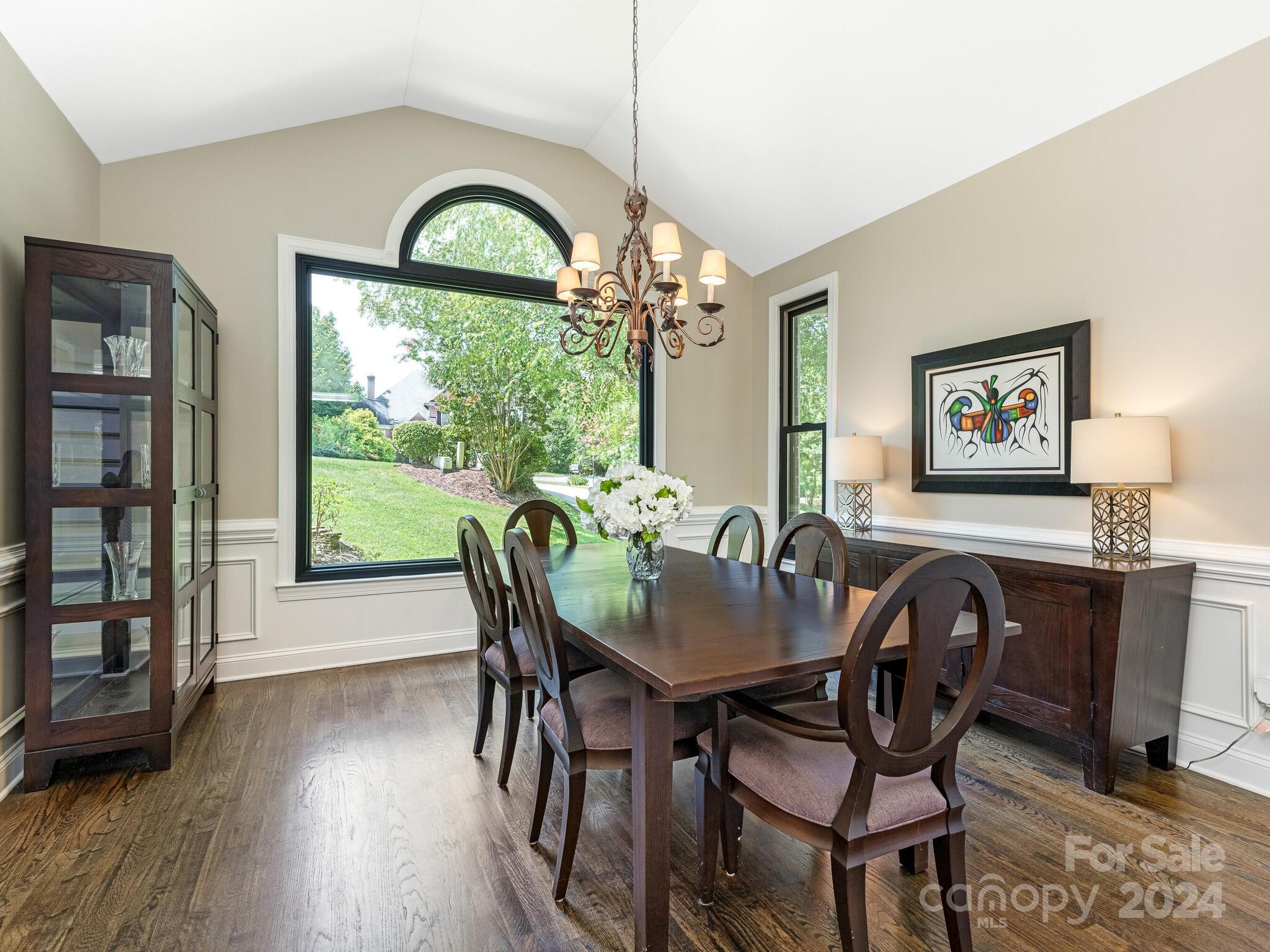 3234 Planters Ridge Road Charlotte, NC 28270 - Photo 5 of 33 a dining room with furniture a large window and wooden floor