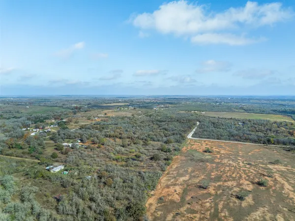 a view of a field with an ocean