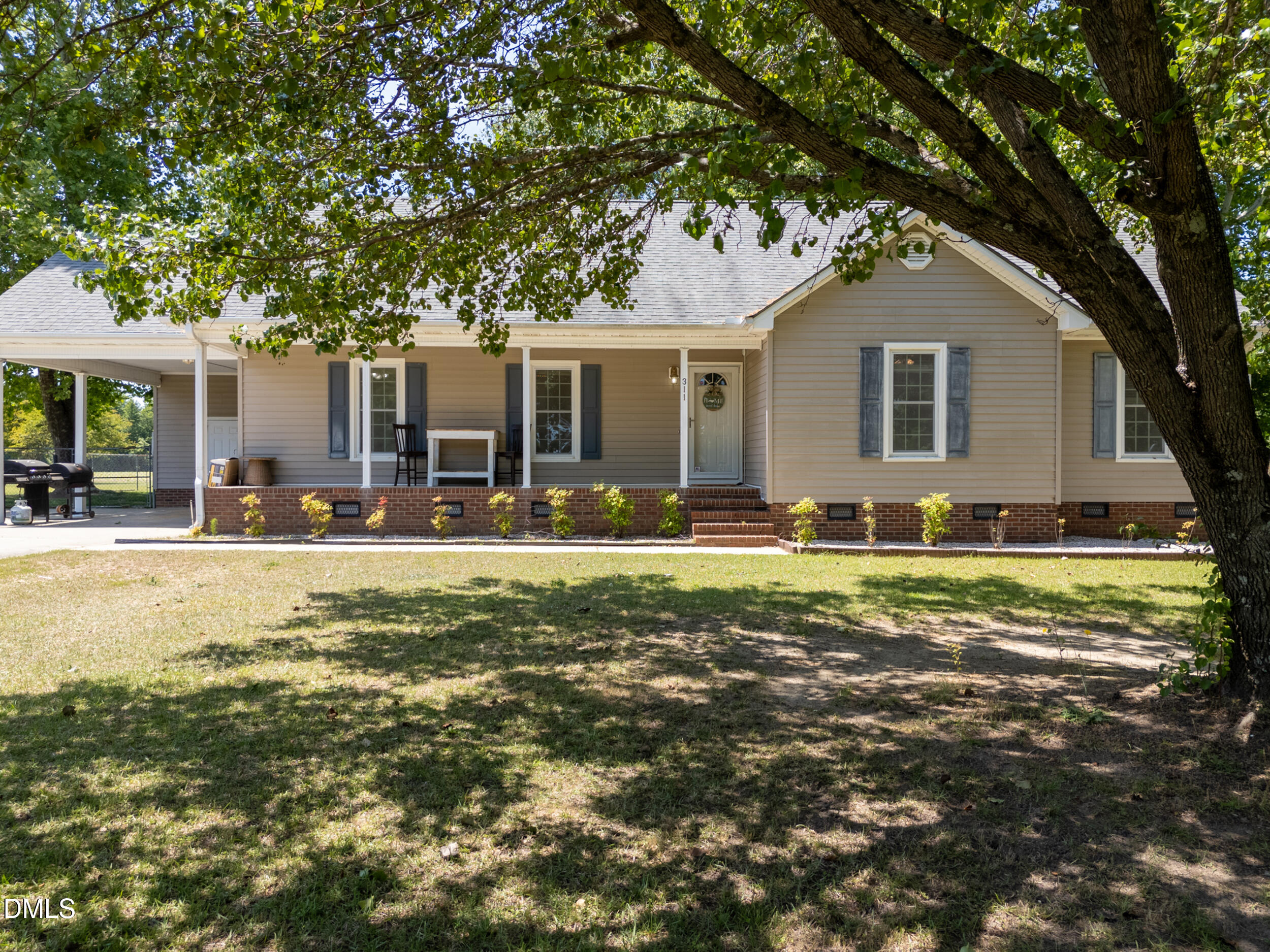 311 Bridgers Road Kenly, NC 27542 - Photo 2 of 46 a front view of house with yard and trees around