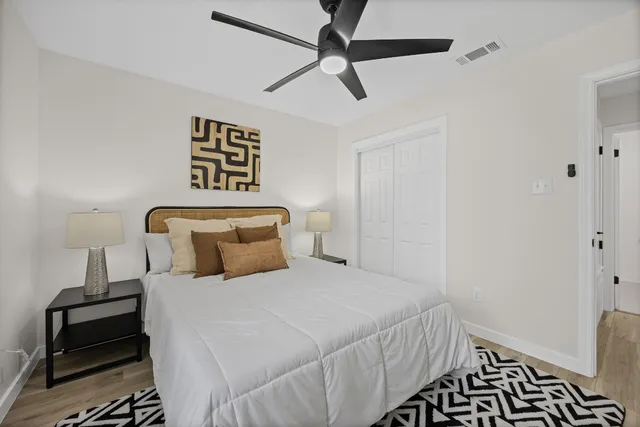 a bedroom with a bed and a window