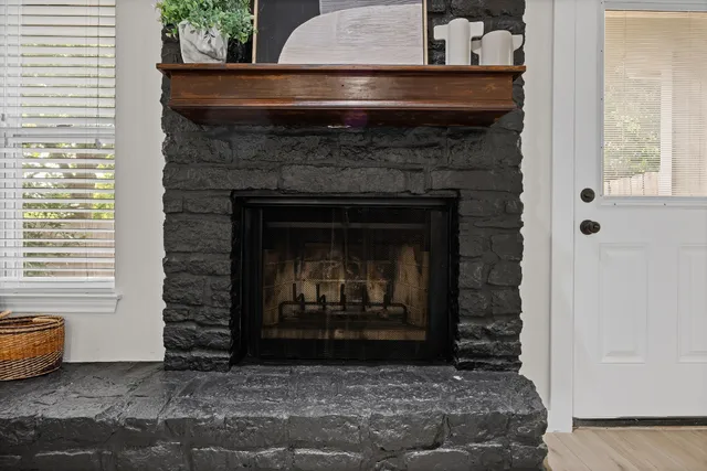 a dining room with furniture and a fireplace