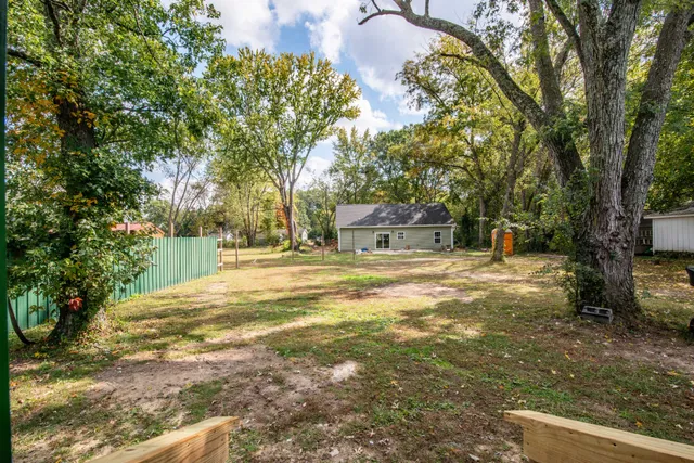 a view of street with large trees