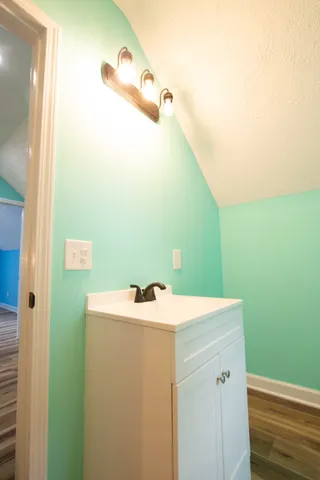 a bathroom with a sink and mirror