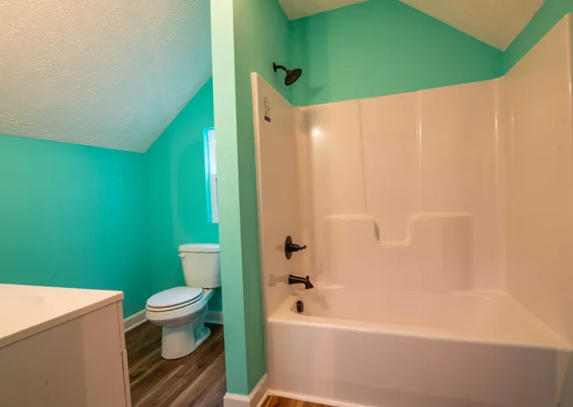 a bathroom with a sink toilet and bathtub