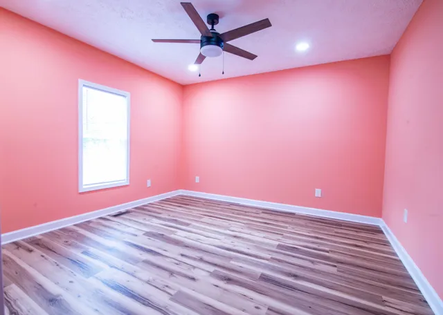 a view of an empty room with a window