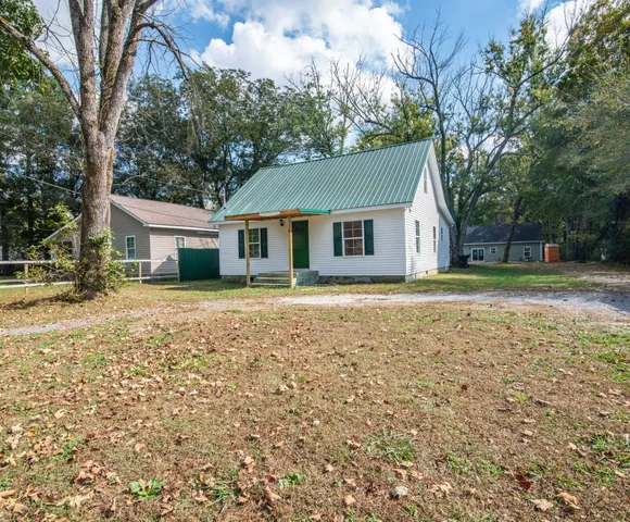 a house with trees in the background