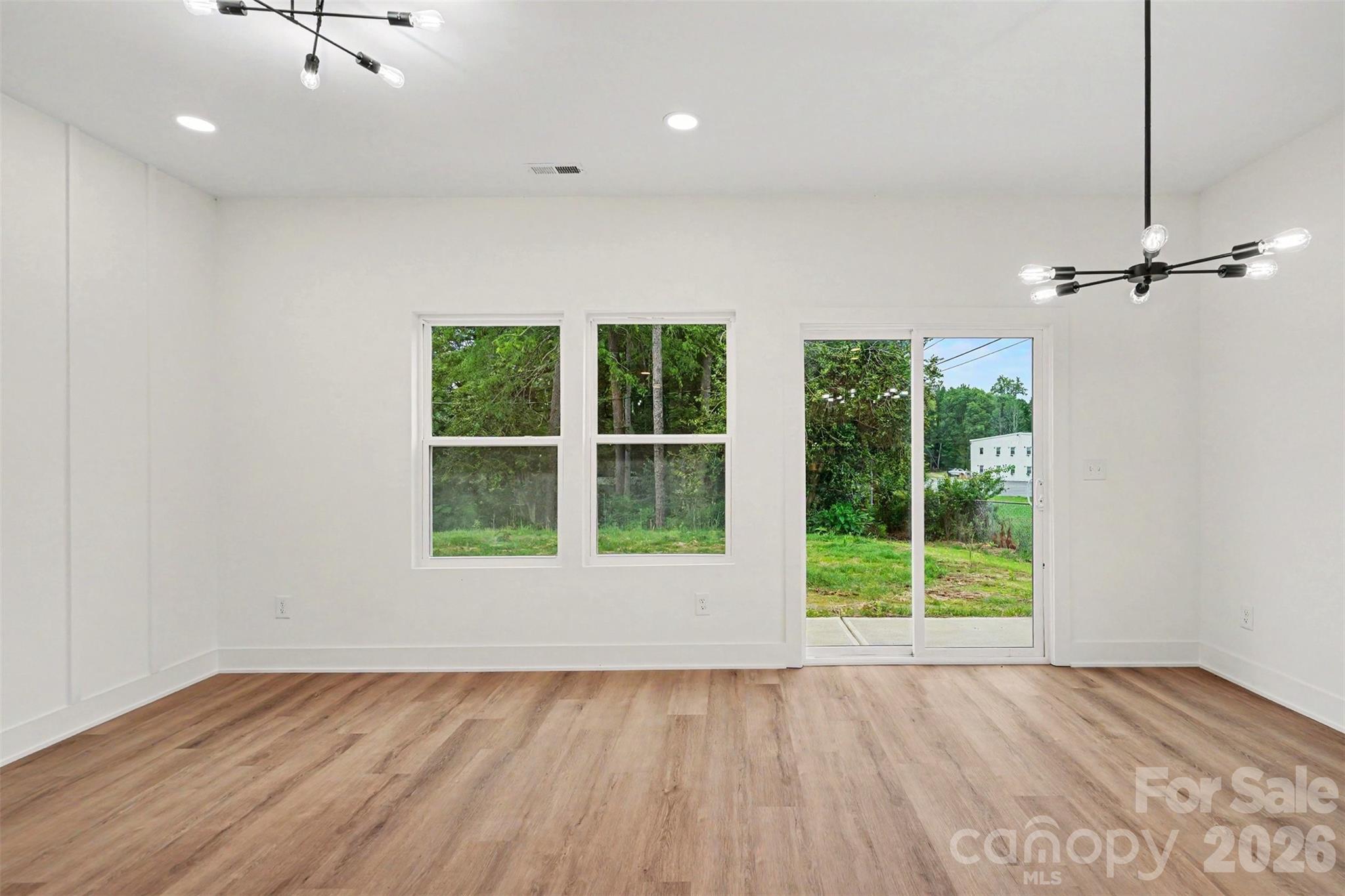 7521 Lawyers Road Charlotte, NC 28227 - Photo 19 of 35 wooden floor in an empty room with a window