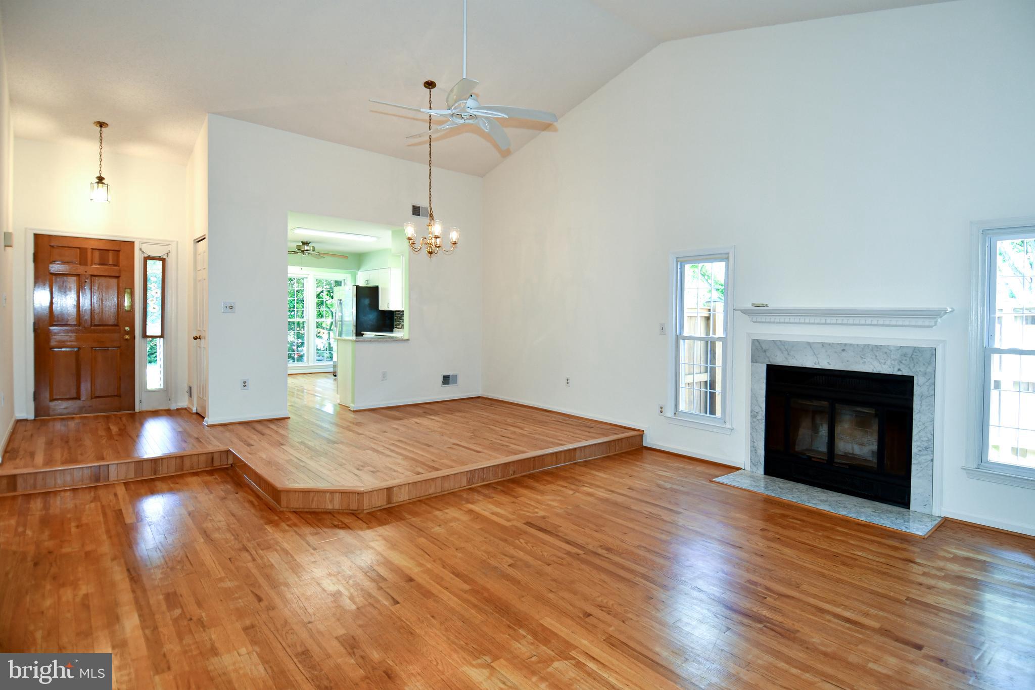 6730 Anders Terrace Springfield, VA 22151 - Photo 4 of 38 Living Room/Dining Room with fireplace