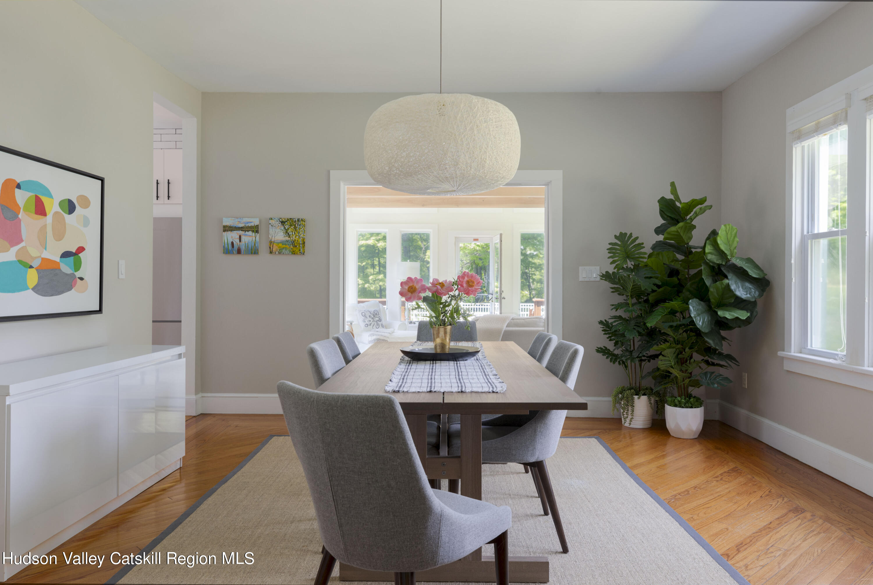 12 Church Hill Road Rifton, NY 12471 - Photo 11 of 33 a dining room with furniture potted plants and wooden floor