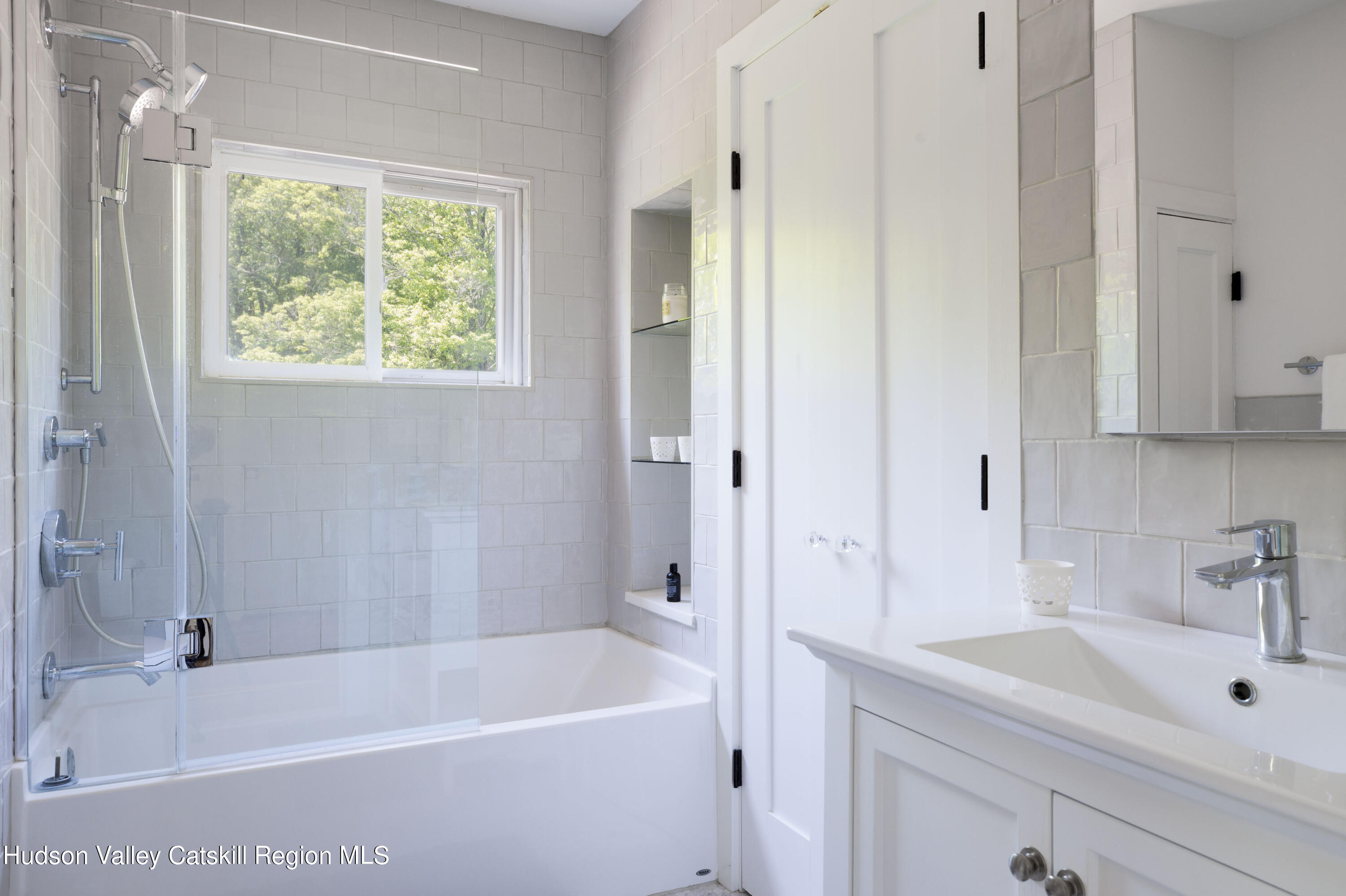12 Church Hill Road Rifton, NY 12471 - Photo 23 of 33 a white bath tub sitting next to a white sink and vanity
