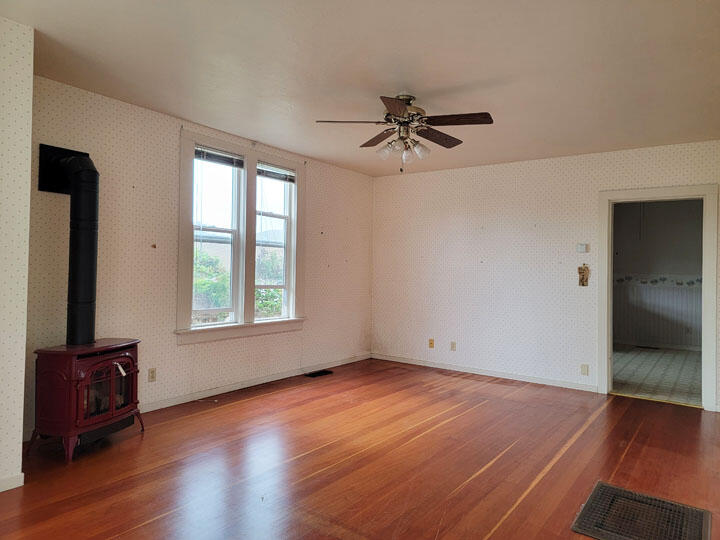 120 13th Street Arcata, CA 95521 - Photo 6 of 37 a view of empty room with wooden floor and fan