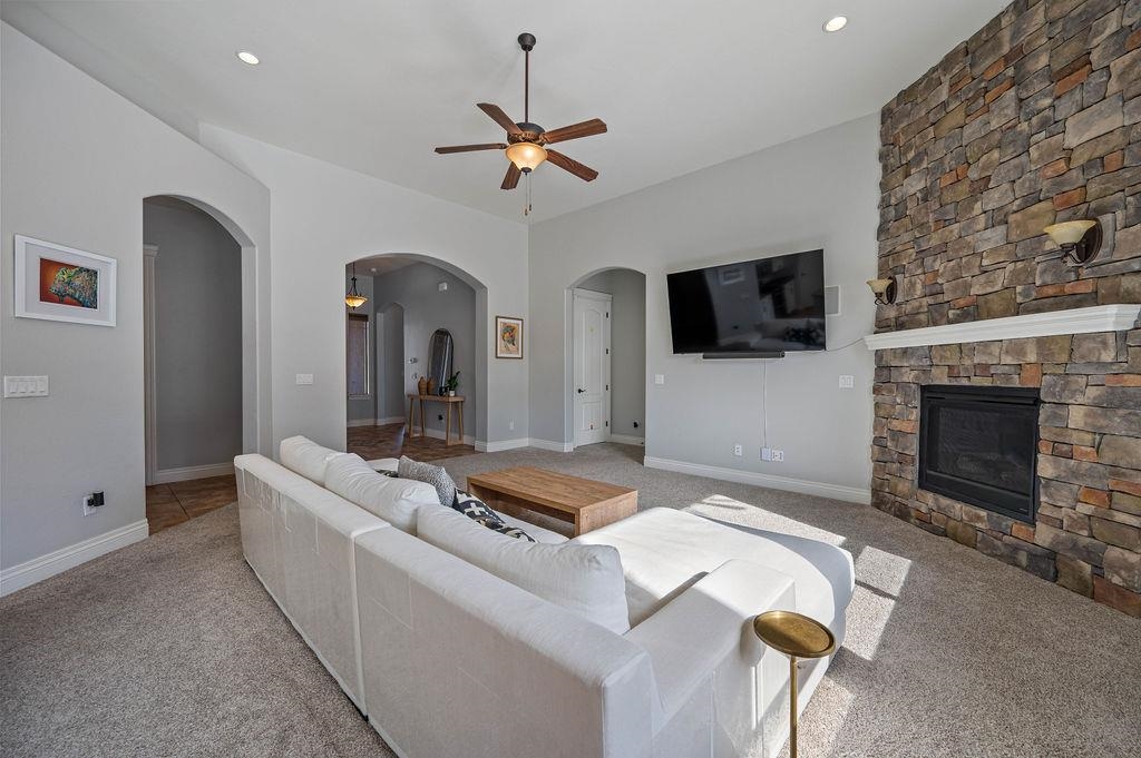 2283 Trail Ridge Road Grand Junction, CO 81507 - Photo 12 of 35 a living room with furniture and a fireplace