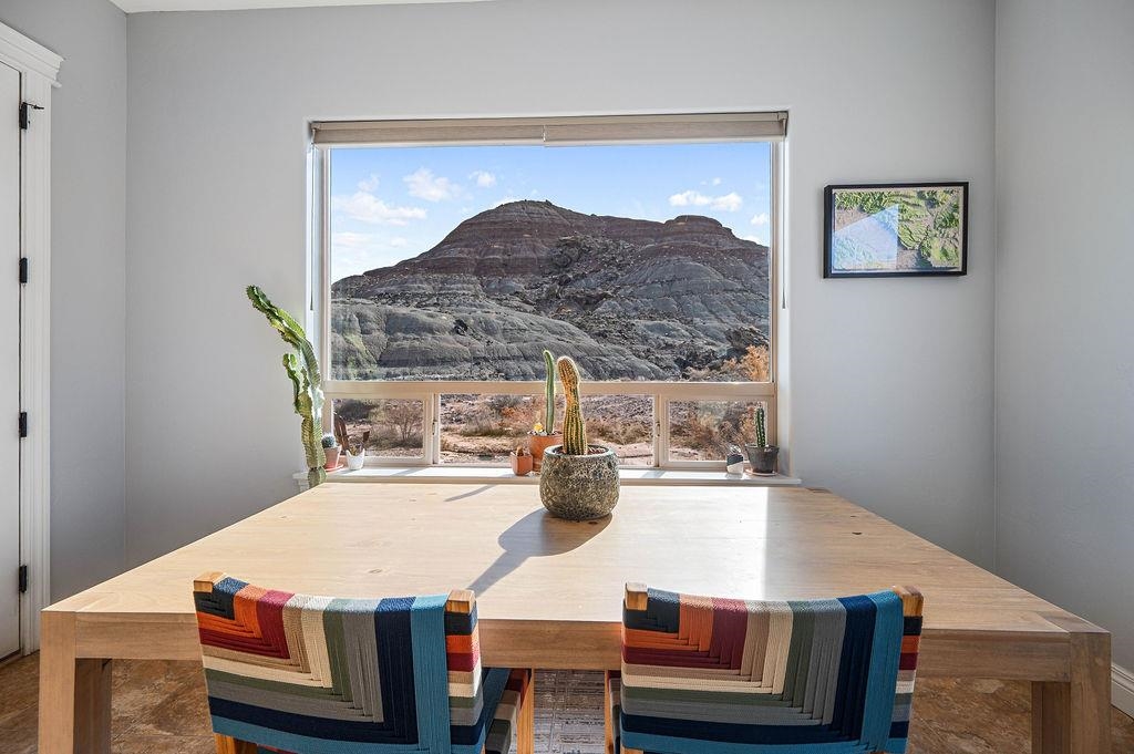 2283 Trail Ridge Road Grand Junction, CO 81507 - Photo 16 of 35 a dining table with chairs and window