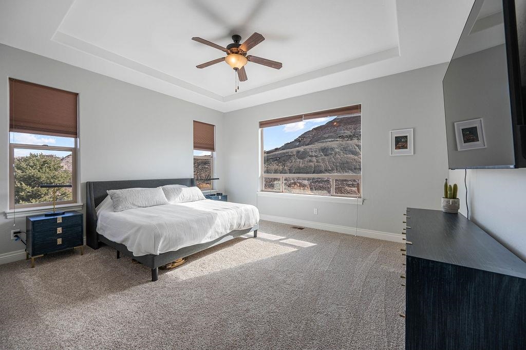2283 Trail Ridge Road Grand Junction, CO 81507 - Photo 17 of 35 a spacious bedroom with a large bed and a window