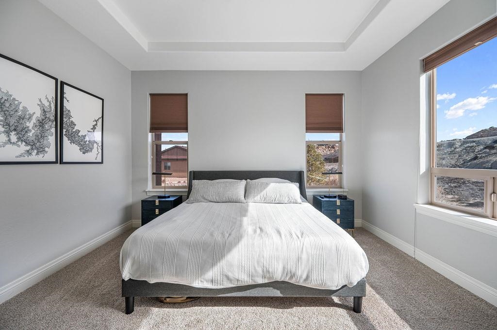 2283 Trail Ridge Road Grand Junction, CO 81507 - Photo 18 of 35 a bedroom with a large bed and a window