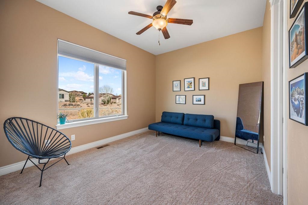 2283 Trail Ridge Road Grand Junction, CO 81507 - Photo 24 of 35 a bedroom with furniture and a window