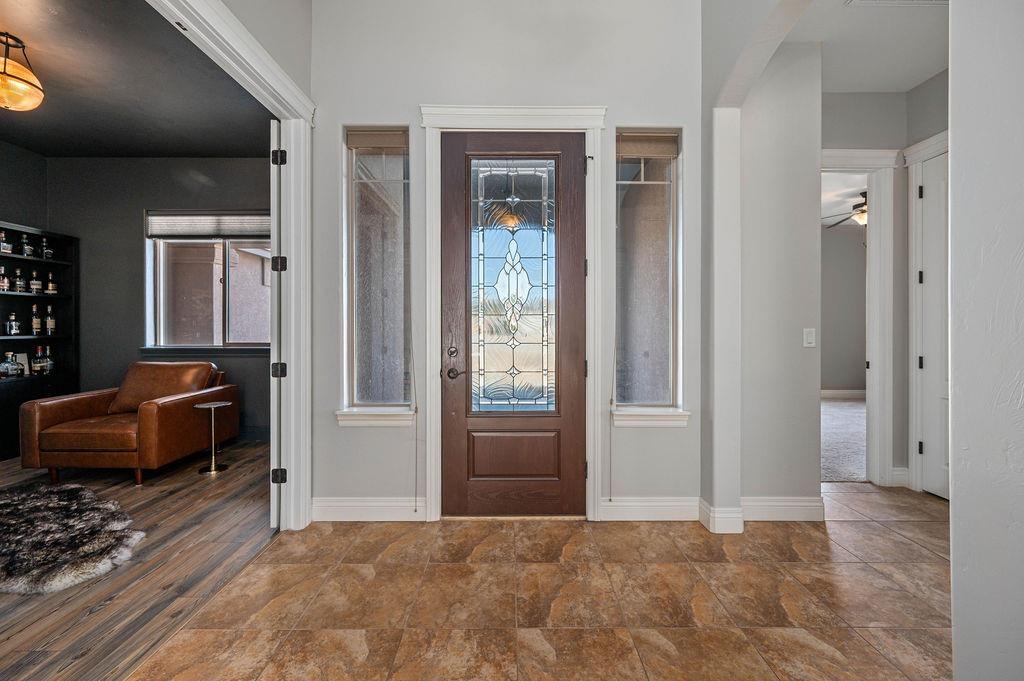 2283 Trail Ridge Road Grand Junction, CO 81507 - Photo 8 of 35 a view of a livingroom with wooden floor and windows