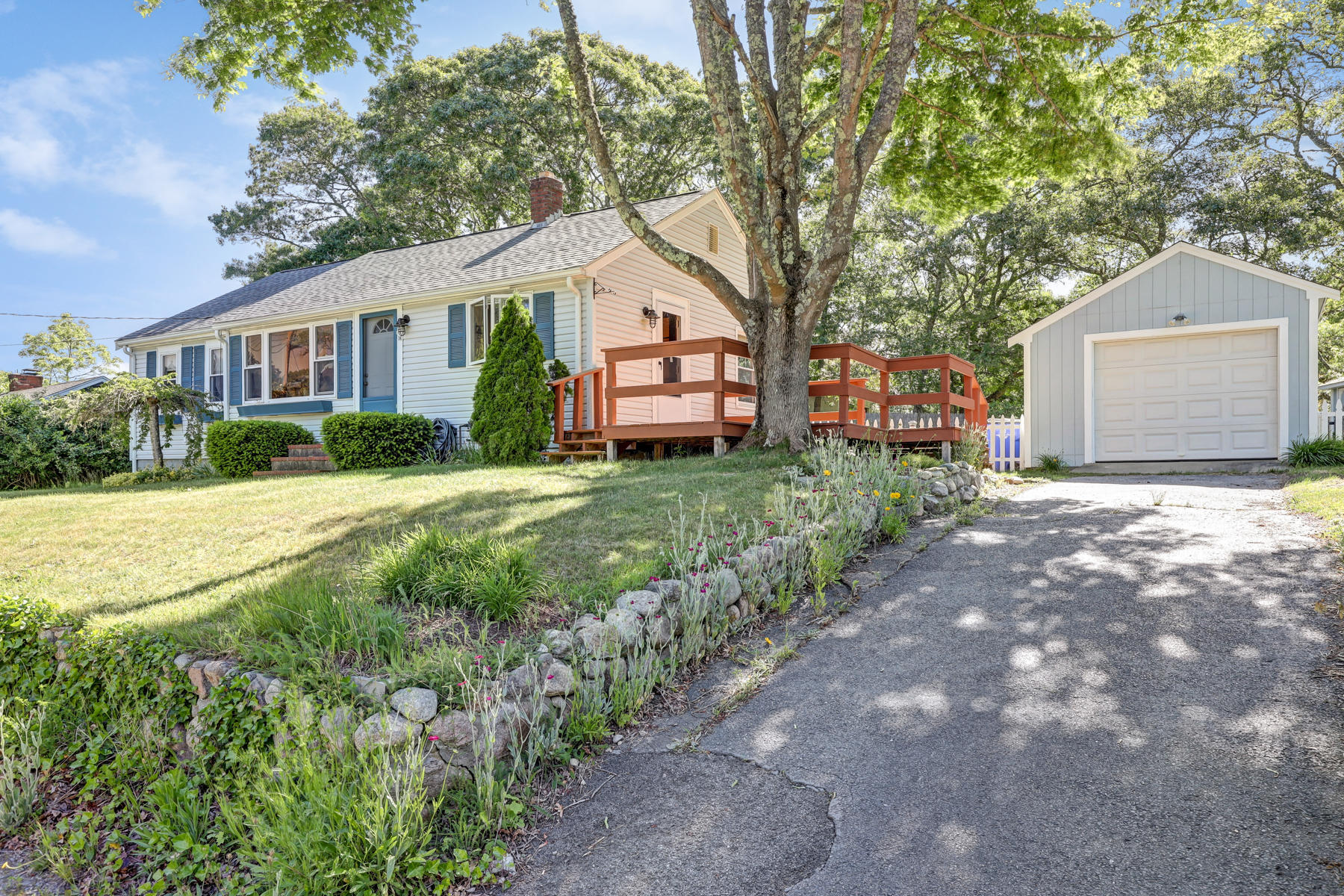 16 Florence Street Monument Beach, MA 02532 - Photo 1 of 35 a front view of a house with a yard and garage