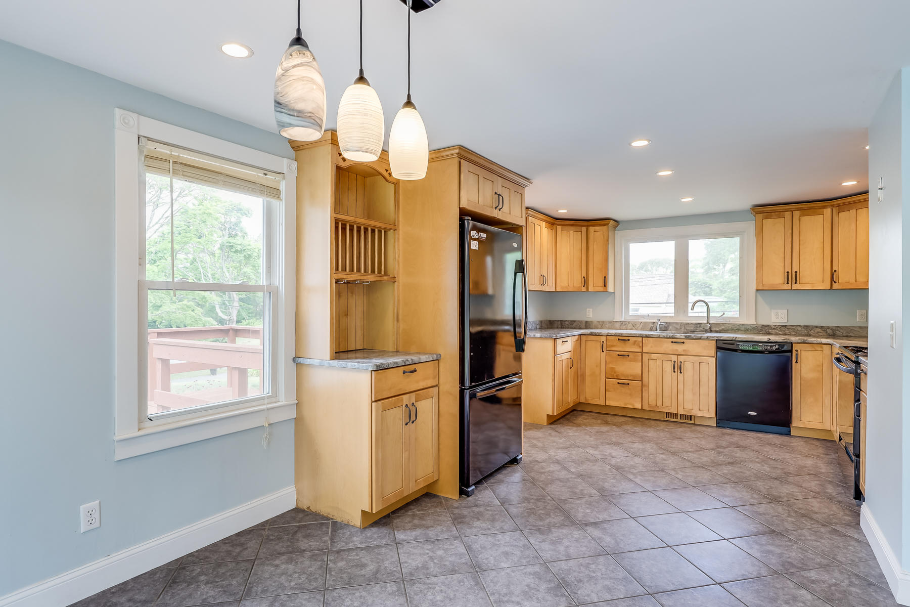 16 Florence Street Monument Beach, MA 02532 - Photo 12 of 35 a kitchen with stainless steel appliances granite countertop a stove a sink a refrigerator and island