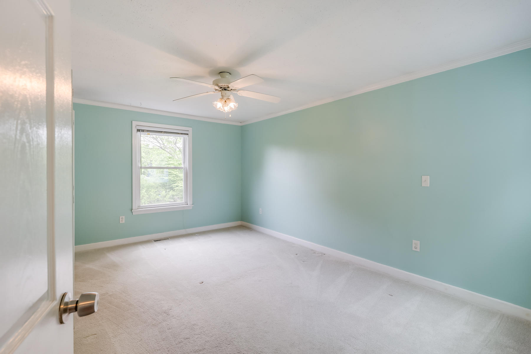 16 Florence Street Monument Beach, MA 02532 - Photo 16 of 35 an empty room with windows and fan