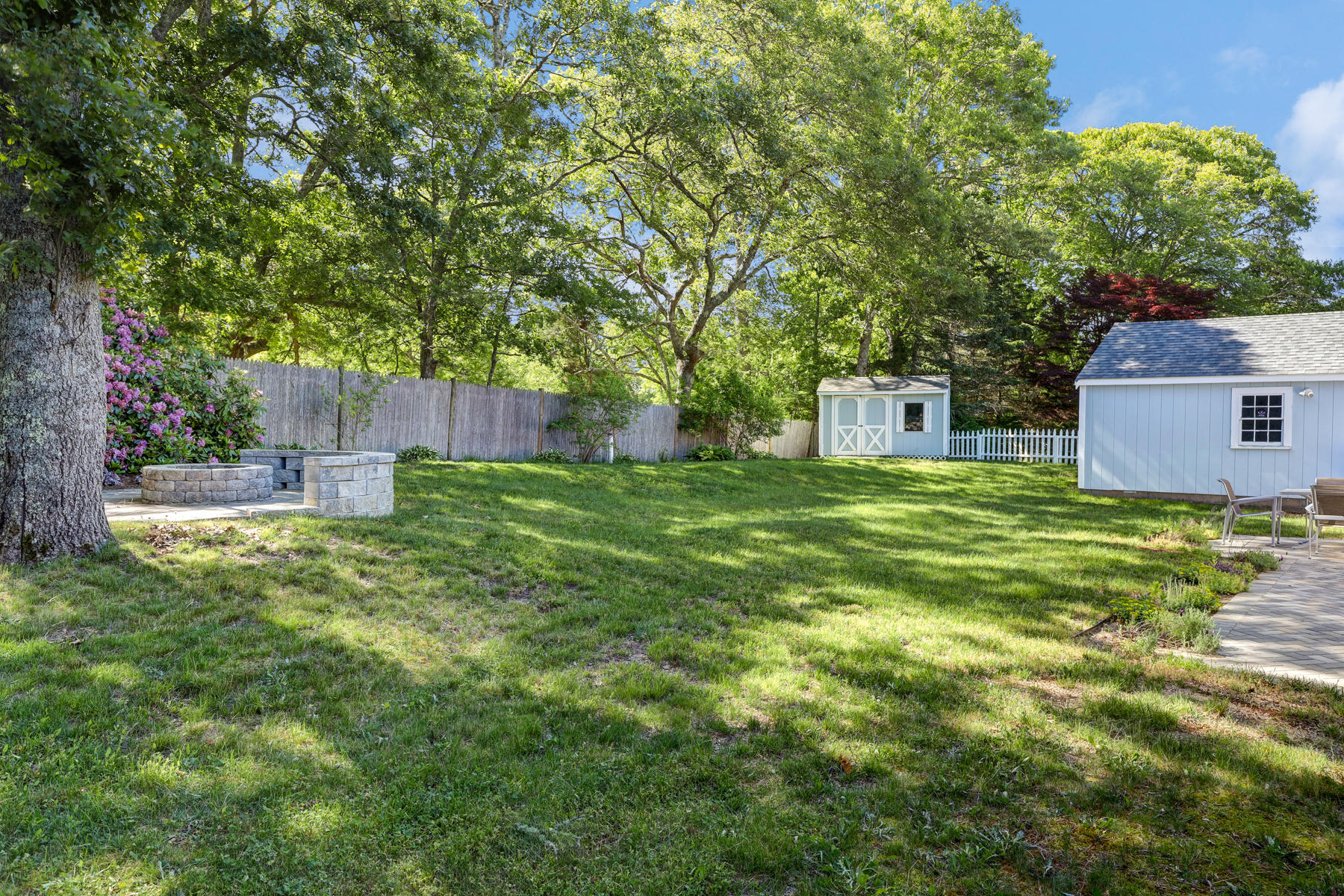 16 Florence Street Monument Beach, MA 02532 - Photo 23 of 35 a backyard of a house with table and chairs