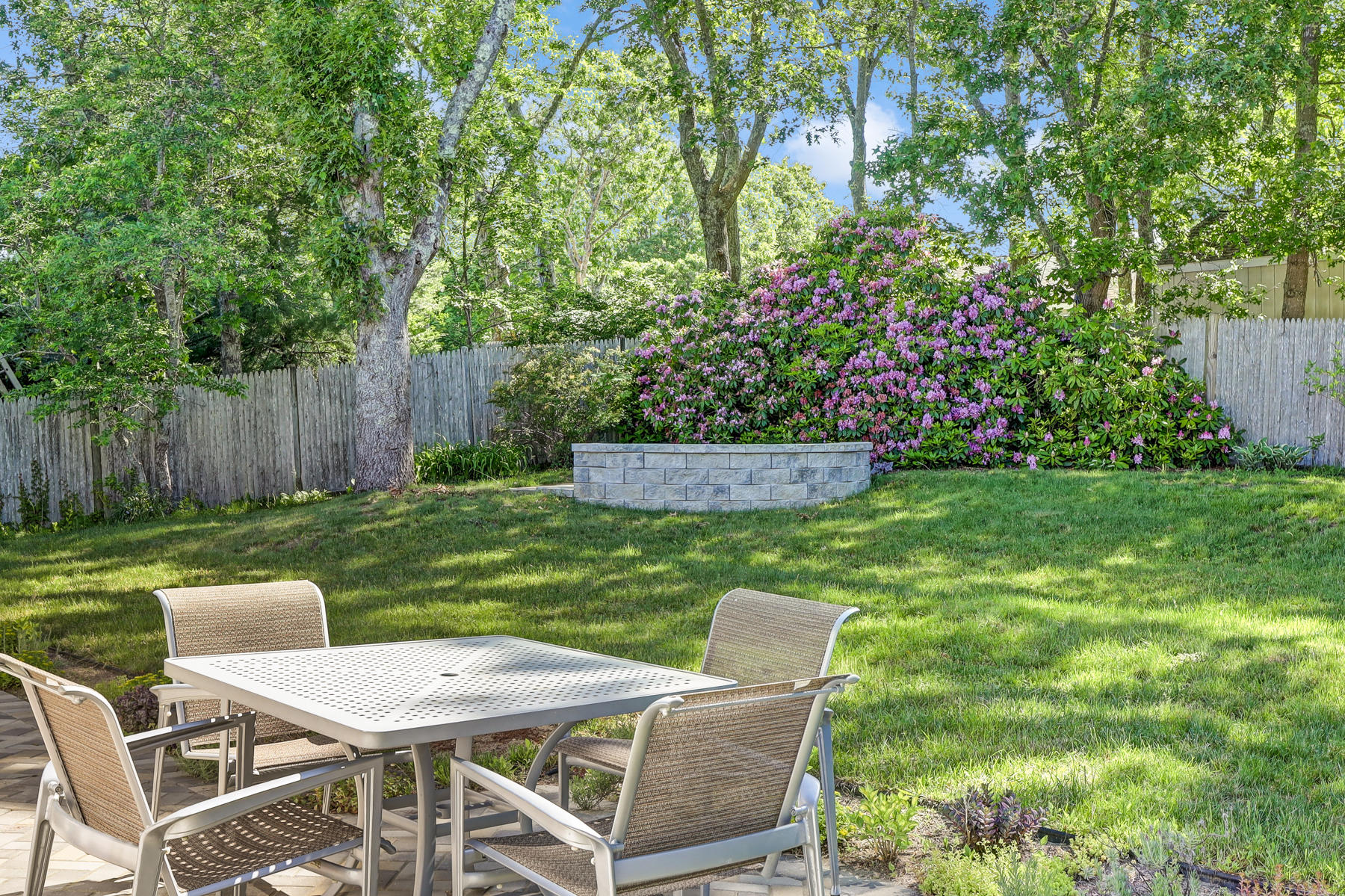 16 Florence Street Monument Beach, MA 02532 - Photo 25 of 35 a view of a chair and table in the garden