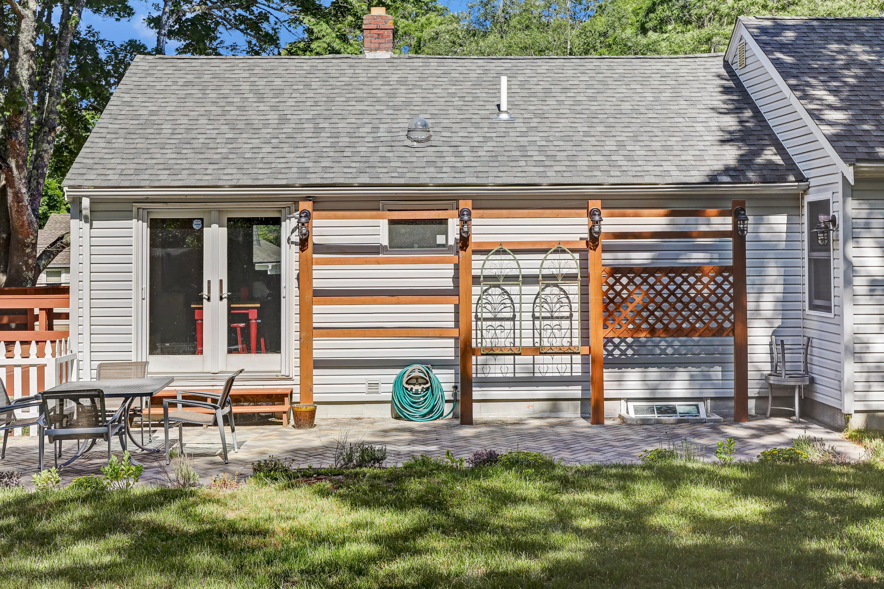16 Florence Street Monument Beach, MA 02532 - Photo 29 of 35 a view of house with backyard and sitting area