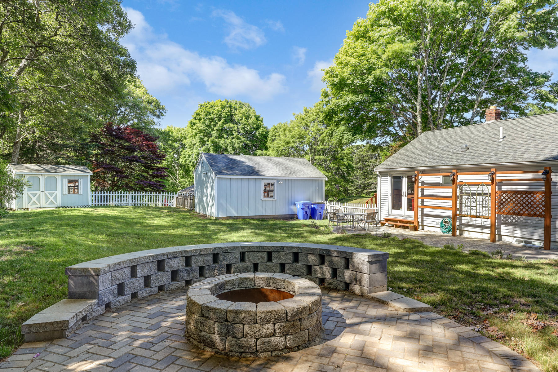 16 Florence Street Monument Beach, MA 02532 - Photo 31 of 35 a couple of table and chairs in the garden