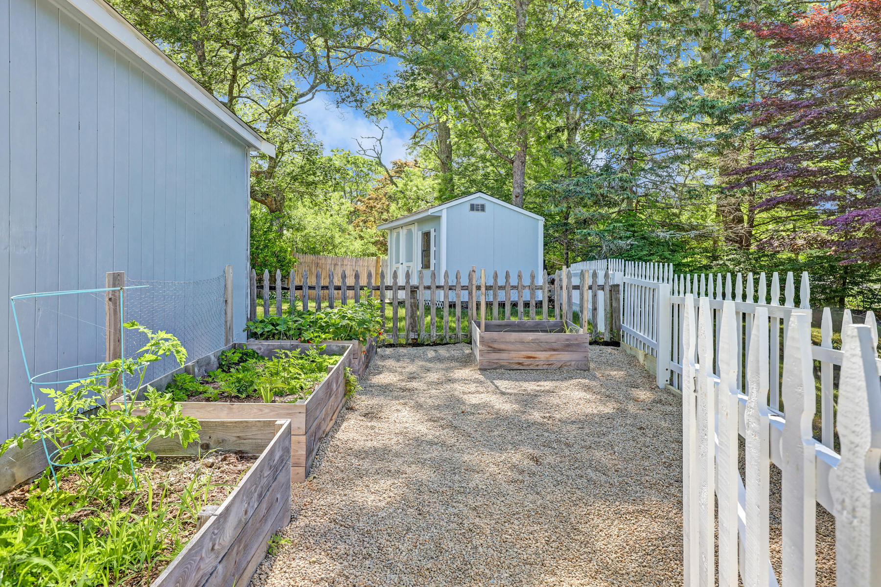 16 Florence Street Monument Beach, MA 02532 - Photo 33 of 35 a view of a house with a small yard and wooden fence